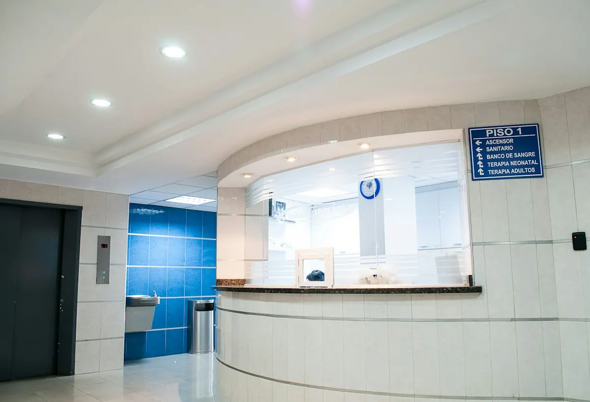 Front desk coordinator confirming a patient's insurance eligibility on screen before the appointment