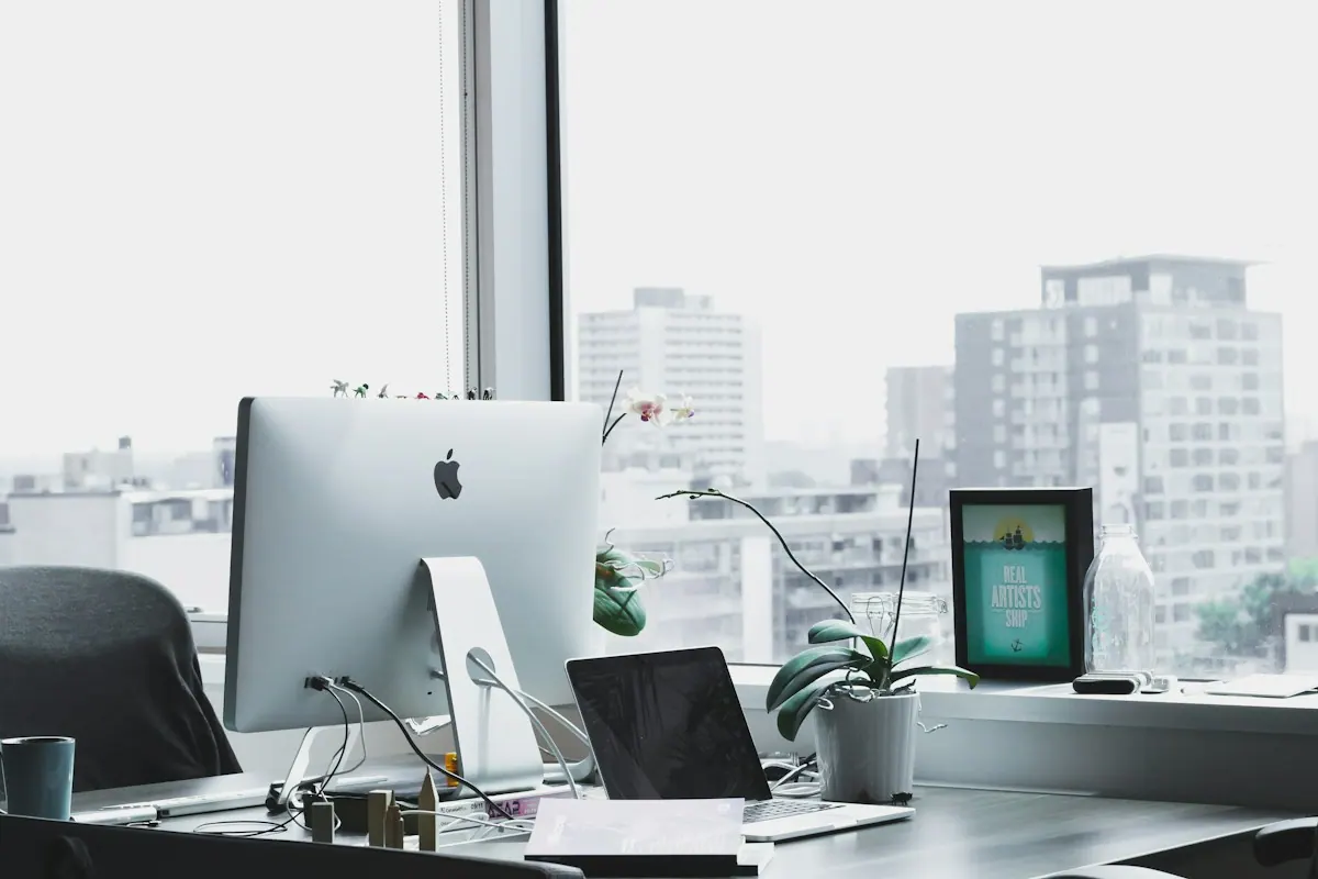 Payment posting specialist matching an electronic remittance to a bank deposit at an office workstation