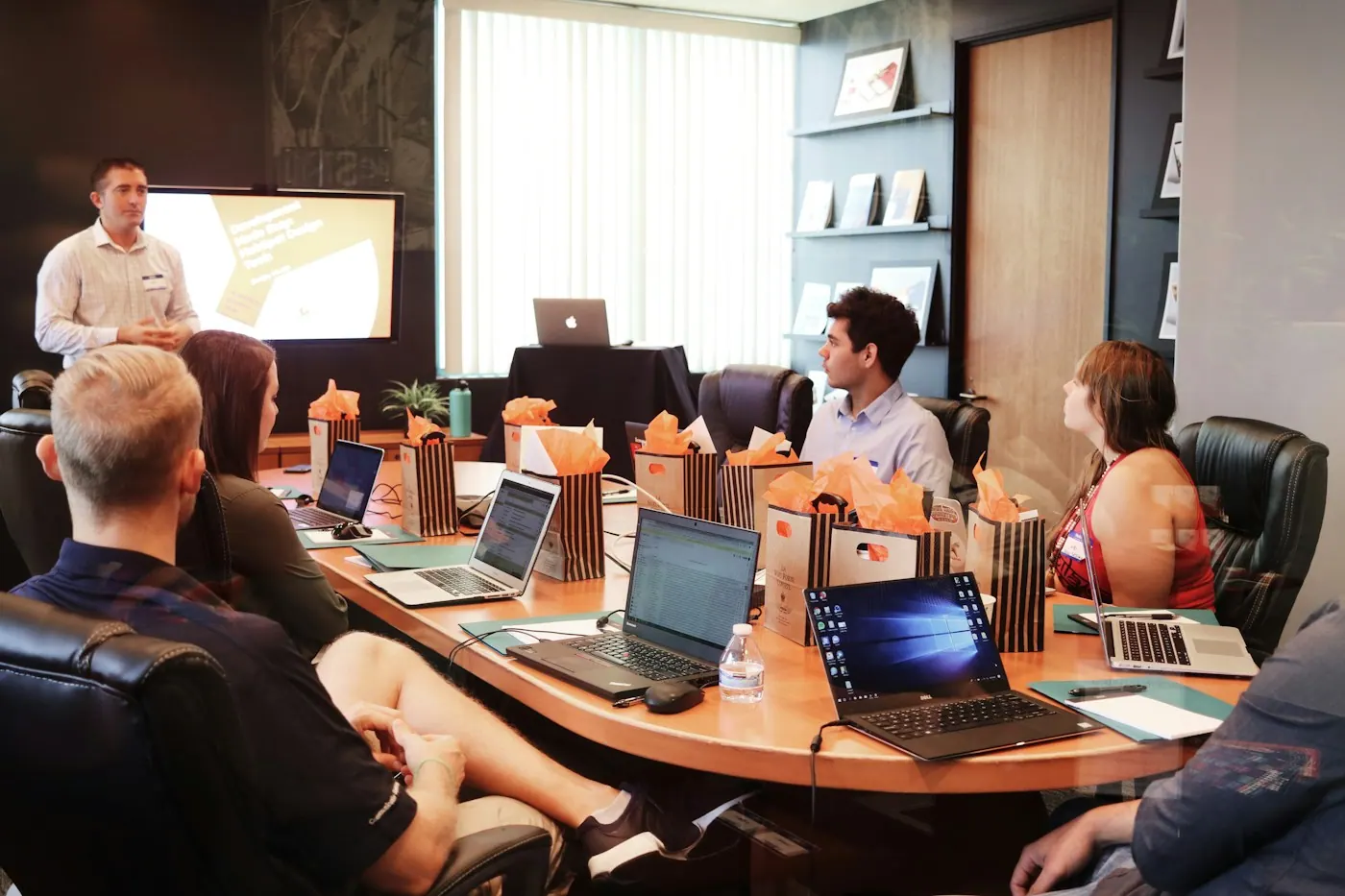 DyBilling billing staff working at laptops around a conference table